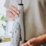 Bouteille d'huile avec poisson